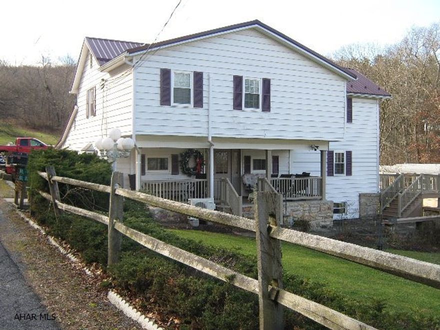 Wonderfully maintained home on 3.875 acres.  Main house has a newer heat pump and central air.  Very large master bedroom with two walk-in closets and on suite bath.  Second bedroom is almost same size as master with a walk-in closet.  Third bedroom has an entire wall of built ins.  Guest house is a singlewide trailer.  Guest house has also been meticulously kept.  Would be excellent income producer, or mother-in-law suite.