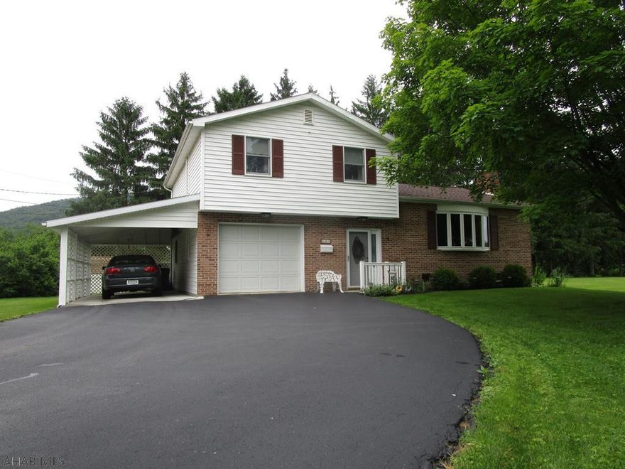 This meticulously maintained split level home rests on just over an acre and adjoins the Elks Golf Course!! Main level offers a large walk-in foyer, over-sized laundry room and an office/den. Second level has a living room with picture window and gas log fireplace, kitchen with breakfast bar and a dining room with a view of the golf course. Third level has a master bedroom with master bath, two additional bedrooms and another full bath. Heat pump with central air-conditioning, back-up electric BB heat, and 200-amp electric. One-car attached garage, one-car carport and a macadam driveway. Rear covered deck, ceramic tile patio and storage shed. Convenient to all amenities; walk over to the golf course, the country club, the tennis courts or downtown Bedford!