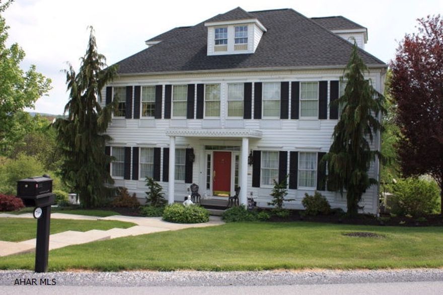 Impeccable 4 bedroom 3.5 bath home with space galore on large .44 acre double lot.  Enjoy the beautiful views from the deck featuring a full awning.  This is a full 2 story home with an attic walk up with tons of storage.  Full master suite with master bath and walk in closet.  Hardwood floors accent the home which has lots of living space.  Formal dining room, full living room and large den.  Lots of windows throughout.  Storage abounds - and the home has been so well maintained.  Don't miss the opportunity to own this large, move in ready home.