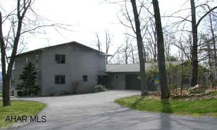 I-99 N. TURN RIGHT TO WARRIORS MARK, T.R. LAUREL MOUNTAIN COURT.  VERY EXTRAORDINARY HOME. FANTASTIC VIEW. LARGE WINDOWS GIVES THIS HOME A VERY BRIGHT & CHEERFUL ATMOSPHERE. SEE THROUGH FIREPLACE. FINISHED BASEMENT. A MUST SEE!  PRIVATE WOODED LOT.