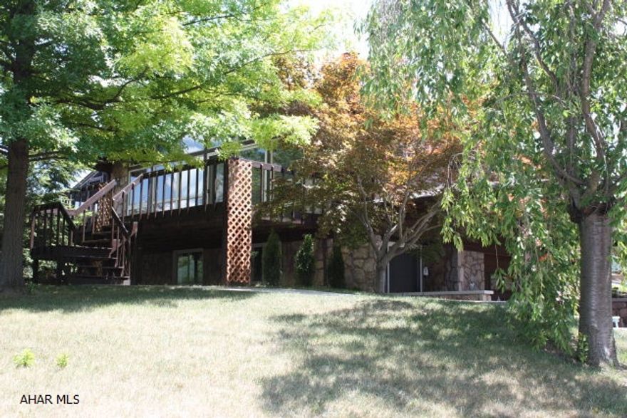 Don't miss the summer - enjoy the pool and outside relaxing areas of this beautiful cedar sided contemporary home with cathedral ceilings.  Inground swimming pool and a 'Garage-mahal'- Two huge heated garages which park at least 5 cars.  Huge florida room, screened outdoor seating area and outside breezway entertainment area.  Basement living area has 3/4 bath and could be used as a bedroom.  Other rooms could be converted to sleeping areas.  Great for entertaining!  Hardwood floors and tons of storage above garage.  First floor laundry.  Incredibly well cared for and attention to details - original owners.