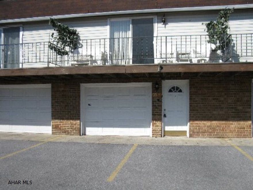 Rare find...a townhouse with a garage!  Lovely 2 bed 1.5 bath townhouse with garage, balcony deck and patio. All new thermopane windows and doors. Located at top of hill for great view and no through traffic.  $140/mo. association fee covers lawn care, snow removal, trash collection, exterior maintenance and structure insurance, also use of swimming pool, tennis courts, and new playground!  Flue for fireplace in tack for adding wood or gas fireplace.  Taxes: Co and Twp for 2011, School tax for 2010. Why pay rent?