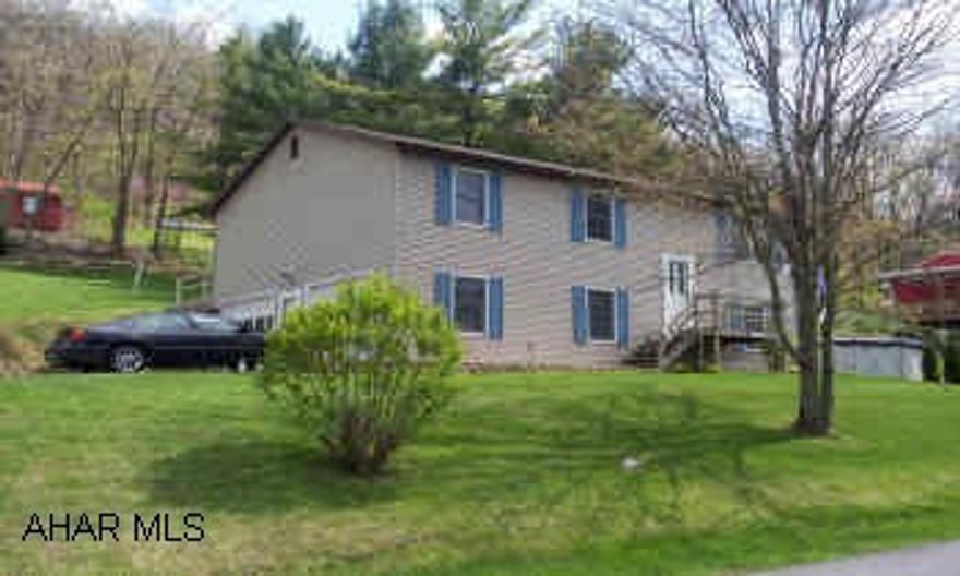 raised ranch home with finished family room, large deck, above ground pool well kept home, close to town location.
