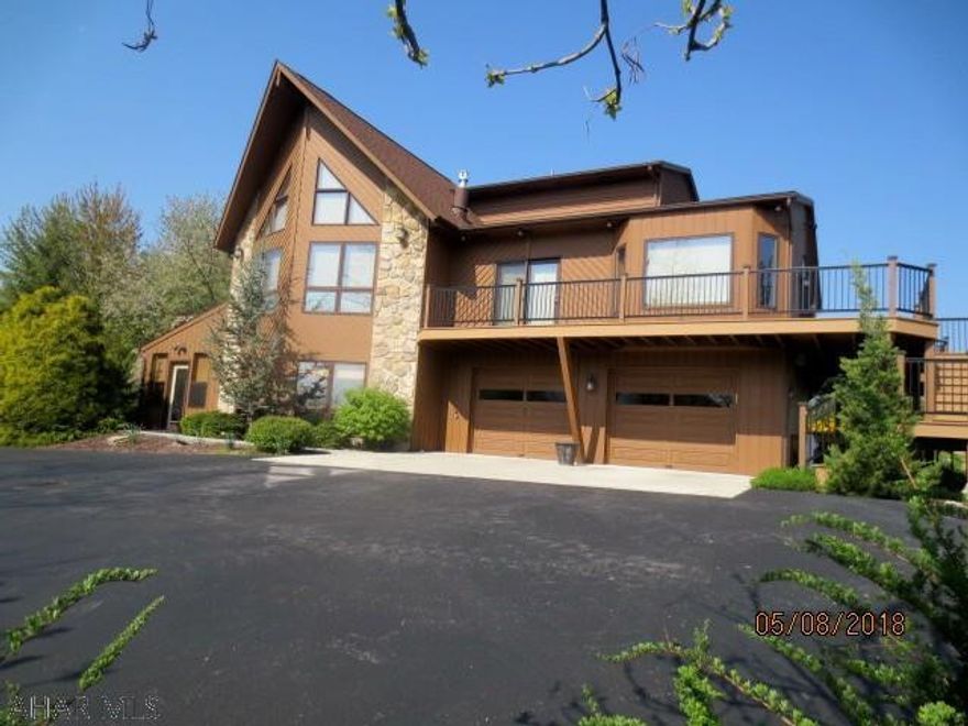 Imaculate cedar sided well maintained and updated Contemporary home with beautiful landscaped yard and priceless view. Newer  Custom Kitchen and baths, engineered hardwood floors, Porcelain and ceramic tile. Family room includes a wet bar, sunroom with propane gas stove, private in-ground pool, outdoor shed. Approximate square footage includes all living area and sunroom.