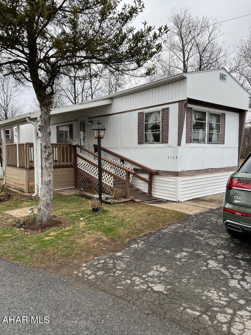 LOT in development, private stream, off street parking, addition added on home, tool shed in back, patio, 3 bedrooms, Full bath, eating area in kitchen.