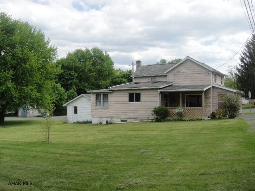 Two story home on corner lot. Two bedroom, one full bath with covered porch and a one car garage. Large, flat yard with detached garage. Oil forced air heat. Nice family home.