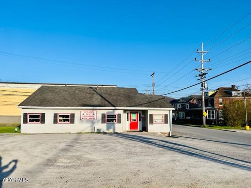 Well established dog grooming business and real estate for sale. One story building with large parking lot.