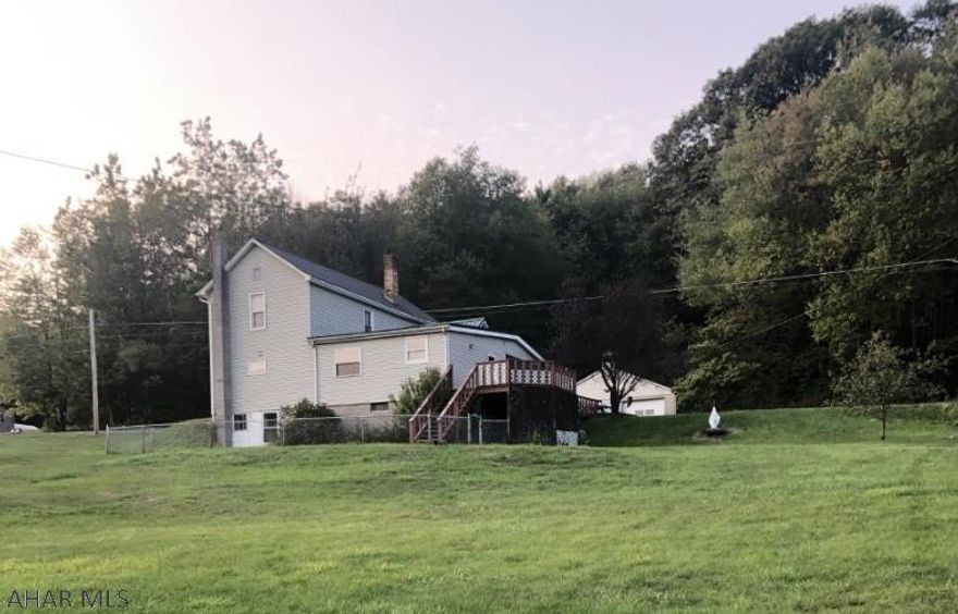 Patton- 2 story vinyl sided 3 BR home on 1.59 acre lot. Oil HW heat. Remodeled kitchen, 2 car detached garage.