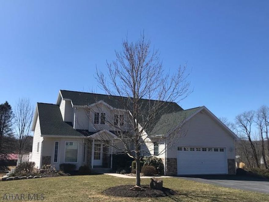 Beautiful well kept home located in Hawthorne manor. home features hardwood floors, first floor Master suite, first floor laundry, stone fireplace, open stair way, full finished walk out basement and two car garage.