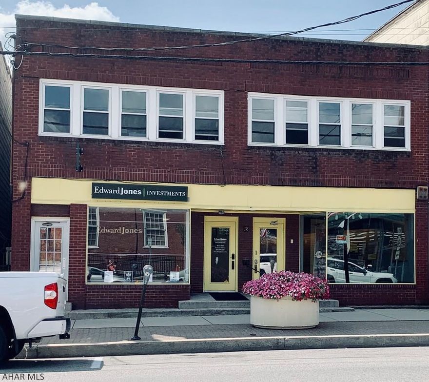 5 Reasons why this building will impress any investor looking for amazing income potential: 1.  Long term rental in first floor business unit with over $100,000 in renovations.  2. Main Street Everett Location (highly visible).  3. Two 220 amp services and Two 100 amp services.  4. Wheelchair accessibility with handicap ramp.  5. Off street parking with 4 car garage storage rentals.  See information sheet for additional  details.