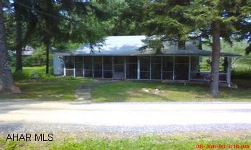 Cozy cottage on over 1/2 acre in Sinking Valley.  Large screened in porch for summer evenings.  A great site for family get togethers or a weekend get away from the city.  Located across from Altoona Rifle Club near Fort Roberdeau. Maintaince free exterior with vinyl siding, thermo pane windows and a 6 year old rolled roof.  Large detatched shed for equipment storage.