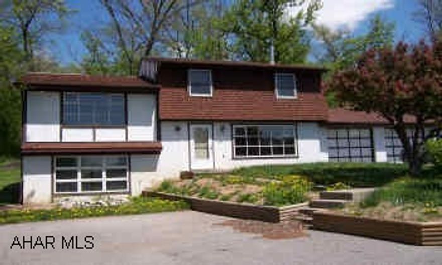 sold as is. See listing agent for addenda.  Split level in Rolling Hills with 2 car attached garage.