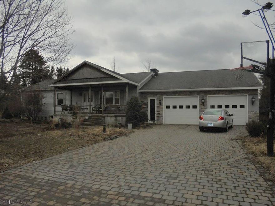 3 BR 1 3/4 bath ranch style home. Gas hot water BB heat.  2 car attached garage.