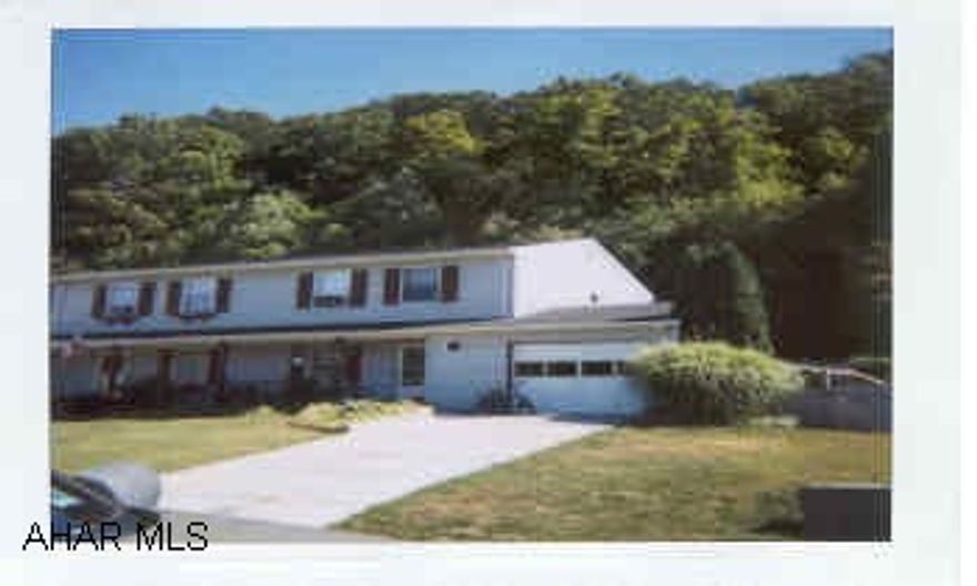 Originally 3 BR-could reinstall wall for 3rd BR.  Great family room off kitchen 16x18 w/skylight - covered patio - must see!!  Woods off backyard.