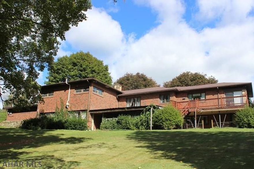 4 BR brick ranch home on a private 0.9 acre lot in Ebensburg.  Kitchen, BR, 3/4 bath FR, laundry and office in basement as well as kitchen, LR, DR, full bath, 3 BRs and sunroom on the 1st floor. 2 wood fireplaces, gas HW heat and 2 car attached garage.