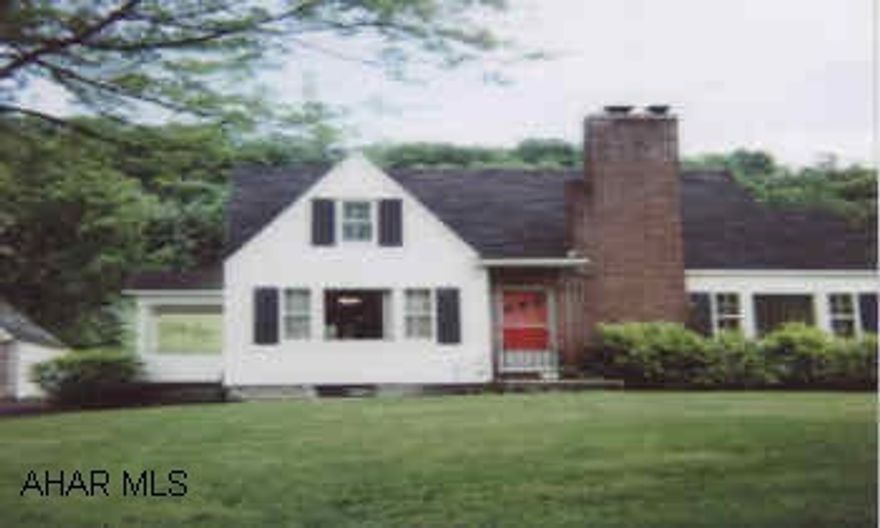 cape cod on 5.26 acres , small pond