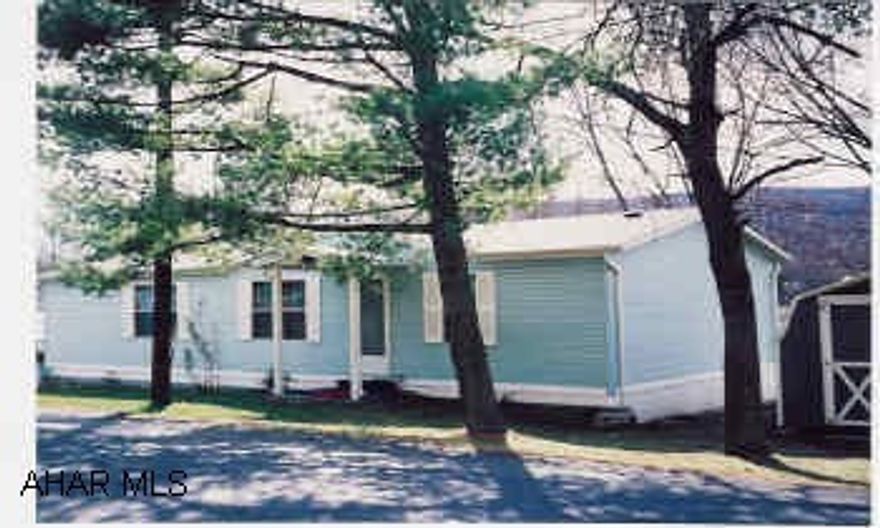 Double-wide trailer on rented lot.