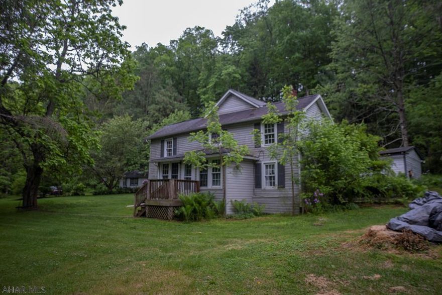 This home is situated on 16.5 acres with an above ground swimming pool and beautiful landscaping with total privacy. This home has 3 bedrooms with one being on the first floor. Enjoy cooking in the large  kitchen  that opens to the family room and dining room. First floor laundry is a bonus. Property also has 2 sheds for plenty of outside storage.  If you are looking for privacy and a warm home look NO further...Schedule your tour today.