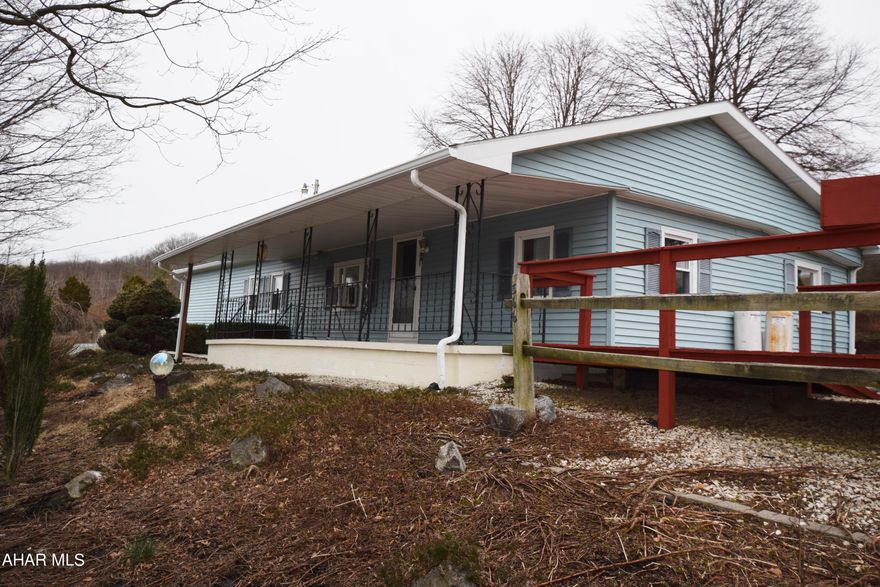 Nice 1972 Mobile Home with addition on large 1.5 acre lot.   Some upgrades.   Big garage with loft.   Covered front porch and open deck.  Home has central air conditioning.   Here's your chance for quiet country living!!!