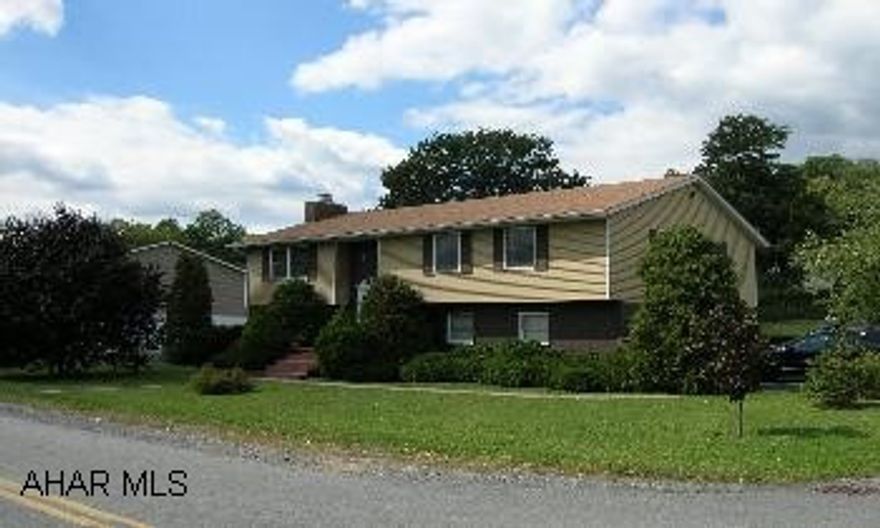 Raised ranch with 3 bedroom, 2.5 baths, vaulted living room, eat-in kitchen, family room w/ bar and fireplace, 2 car garage, central air, and above ground pool with deck.