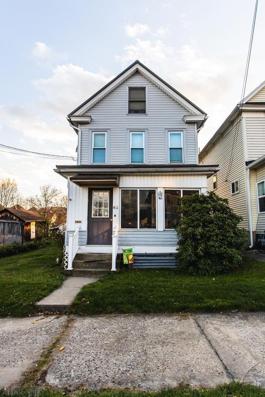 Beautiful 3 bedroom, 1 bath house on a corner lot with a fenced yard and detached 2 car garage. Cozy enclosed front porch. Eating area in kitchen. Central air conditioning. Don't miss the opportunity to make this house your home!