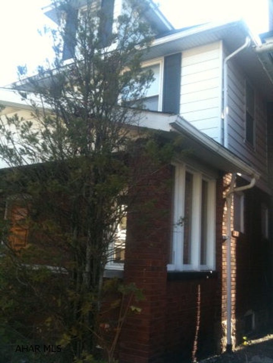 CONTRACTORS.  CASH ONLY. CONDEMMED AND EXTREME WATER DAMAGE.  PROPERTY TO BE TORN DOWN OR TOTALLY GUTTED.  HOUSE IS BRICK AND VINYL.  GARAGE WITH ALLEY ACCESS.  NICE AREA NEAR CAMPUS. AS IS.  SHORT SALE.