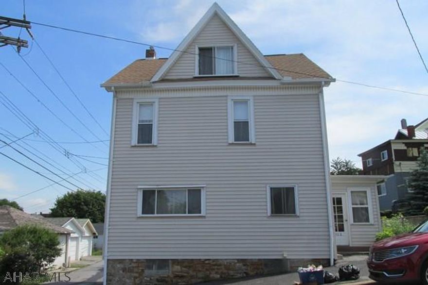 Spacious family home on small corner lot. Enclosed porch leads to a large eat-in kitchen, dining room, and living room. Second floor 3 large bedrooms and full bath. Third floor huge open finished attic. Cute fenced yard. Lots of potential, just needs a little love! new vinyl siding and windows, wiring new on first level. Basement, laundry, utility, sink and toilet.