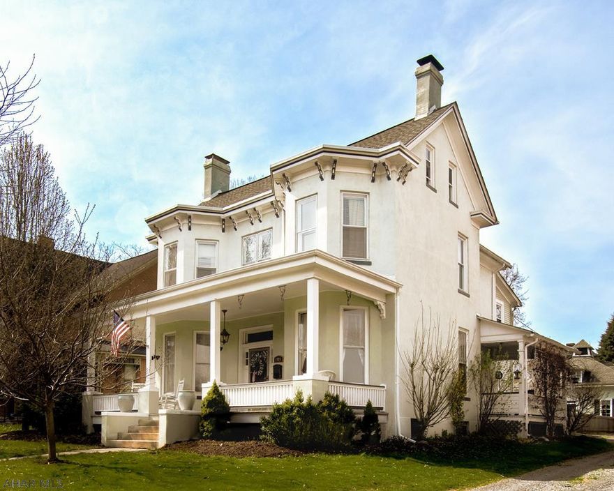 Stunning 5 br/3.5 ba historic home complete with it's own 2 story carriage house with room for two cars.  The present owner unlocked the hidden beauty with tasteful renovations throughout.  Imagine yourself resting by one of the two fireplaces (one wood, one gas), enjoying the newly remodeled kitchen, watching the sunset on one of the three covered porches or relaxing in your own hot tub in a private outdoor setting. 3 zone GHW heat, 1st floor laundry and a huge walk up attic for play are just some of what this fabulous home has to offer.  Schedule your private showing today.