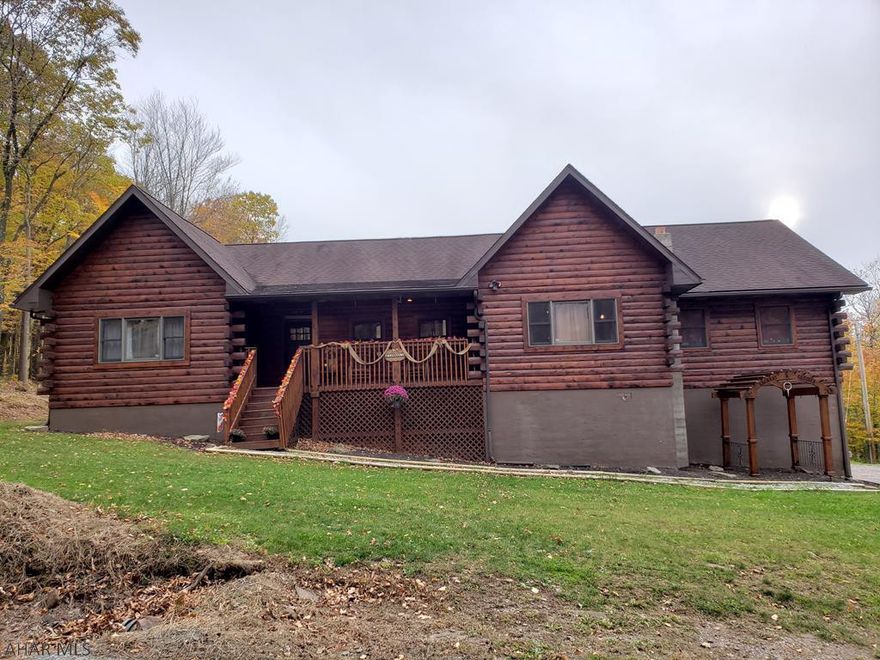 What an incredible opportunity to own a custom-built, Hemlock log home just 2 miles from Blue Knob Resort!  Quality is apparent throughout.  The first floor oak, hardwood floors will be sure to impress.  The maple kitchen offers concrete countertops with hammered-copper sink.  The nearly 4,000 square feet offers space for everyone.  The vaulted ceilings and pellet stove make the living room the perfect gathering space.  There is a convenient, first-floor laundry room. Multiple heating/cooling sources keep the home warm and cozy in the winter and cool and comfortable in the summer. The expansive deck is ideal for any outdoor occasion.  The oversized 2-car, integral garage will accommodate the largest vehicles.  View this stunning home to appreciate the superb features.