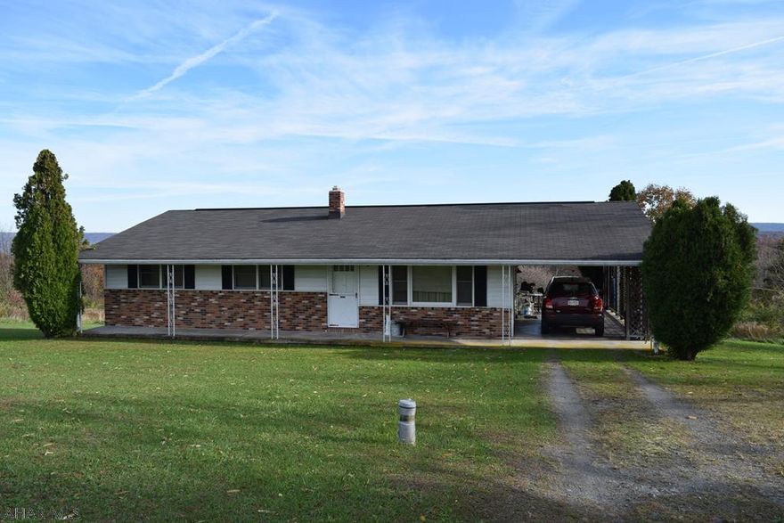 Great three bedroom ranch home only minutes from Raystown lake. With a carport, a two car detached garage situated on 10 acres with amazing views.