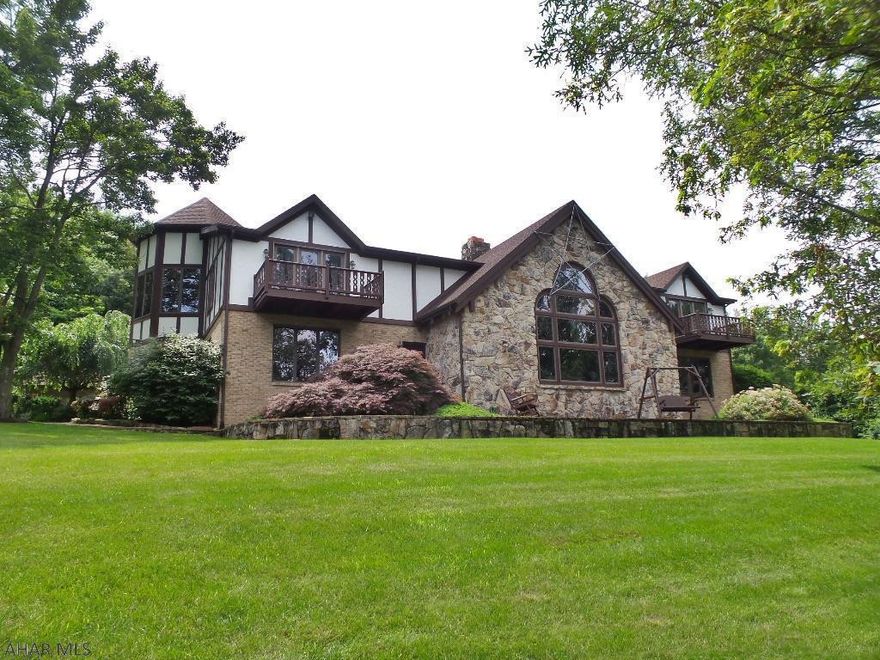 The "Jewel of Blair County" The original owners are offering this custom built home that features 8300 square feet of living space. This one of a kind home not only offers all the amenities you can imagine but it sits on 193+ private acres. Upon entering the home you are greeted by the over the top gourmet eat-in kitchen with commercial grade kitchen appliances. The formal dining room is spacious and has in-floor radiant heat. The formal living room is a quiet area when the beautiful views can be observed. Next you enter the spacious family room that features vaulted ceilings, gas log fireplace and wet bar complete with tap system. After enjoying time in the family room walk through the French doors and enter the indoor pool area, complete with pool, hot tub, diving board and slide. 1