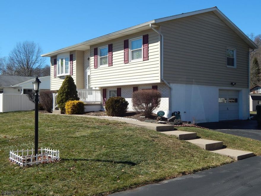 The owners invite you to see this beautiful ONE OWNER split level home that features 3 restful bedrooms and 1 full bath. Also features a spacious living room and eat in kitchen. Plenty of parking with the long blacktop driveway leading up to an integral 1 bay garage with workshop. Also features a large elevated rear deck and updated landscaping. This home has a large flat yard perfect for entertaining friends or family. Located in a desirable neighborhood and is priced to sell. In close proximity to the Memorial Park. Contact the listing agent for more details or to schedule your private tour today!