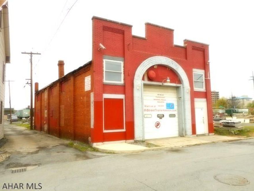 2400 Sq. Ft. commercial building. Former auto repair garage. 2 lifts, code approved.  Industrial area. Great for storage. Cash sale.