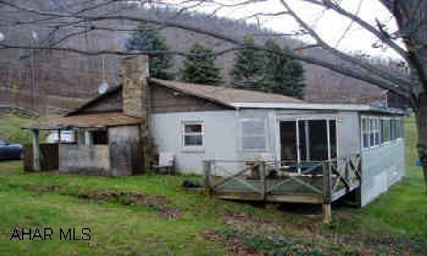 Rustic ranch house with 30 acres, pond, well and spring, bank barn, 4 stall horse barn with grandview. Hunters Paradise. Serene, private location, great property for hunter or naturalist.