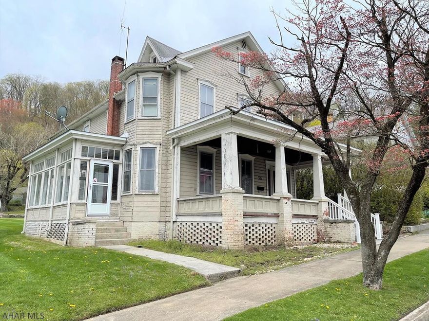 Charming two-story home with tons of character located in the Everett Borough. The main level offers a living room, dining room, den/office with built-ins, kitchen, and half bath. Side sun porch and rear enclosed porch. The second level has two bedrooms, a bonus room that can easily convert to a 3rd bedroom, and a full bathroom. Full walk-up attic that could be finished into studio or additional living space. Oil hot water heat, 100-amp electric and public water and sewer. Large rooms, an open staircase and a nice functional floor plan. Spacious yard with street to alley frontage. Detached, hand stacked stone garage and off-street parking next to it. Centrally located and convenient to all amenities. Bring your paintbrush and build instant equity!!