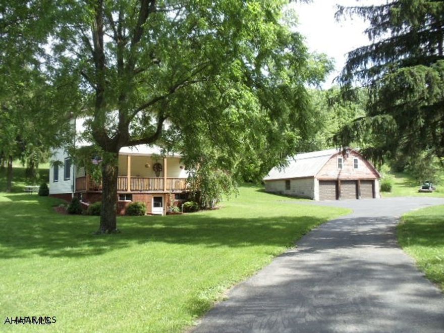 Nice vinyl-sided 3 bedroom, 2 bath home with modern eat-in kitchen, 3 car garage on 3.125 acres. Garage now has new vinyl windows, vinyl siding, sofit and fascia. Also the small shed has new vinyl siding, sofit, fascia and new roof. Old property address was 127 Singer Lane. Estimated 2017 tax assessment $1714.14 (Would have been $2622 with 13.7 acres, however 3.125 acres being sold with this parcel). Buyer must confirm with Blair County Assessment Office.  #J-243