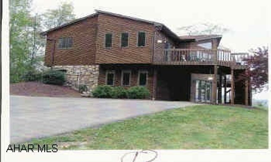 Beautiful cedar & stone contempory on 2.8 acres. Fantastic view wiht Extra Large windows & Decks overlooking Hollidaysburg area. Oak trim, central air, security system, fireplace, wet bar, 16x24 shed, realtor owned.