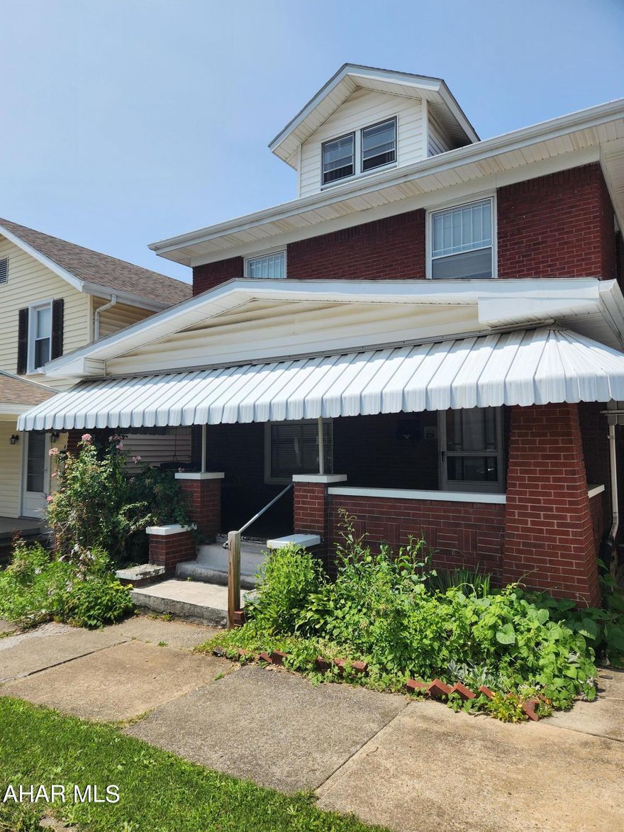 This home offers 3 bedrooms, 1 and a half bathrooms, beautiful hardwood flooring, and original woodwork/trim. The home is in need of updates and remodeling work. The property offers a living room, dining room, half bath, and kitchen on the first floor. The second floor offers 3 bedrooms, a full bathroom, and attic access. The exterior of this brick home offers a covered front and back porch and a small yard in the rear. The water, sewer, and gas are turned off but can be turned on with an accepted offer. The home is being sold in As-Is condition, and the estate is to make no repairs. Call listing agent to view.