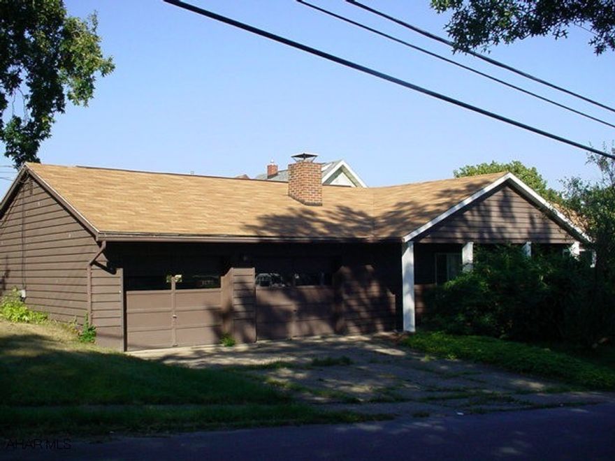 Well-maintained rancher on a corner lot.  Hardwood floors, brick fireplace in living room.  Central air conditioning.  Two-car attached garage.