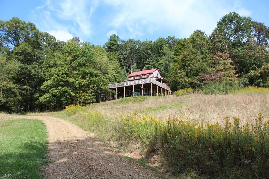 Hunting, recreation, getaway or full-time living, this property also ADJOINS Game Lands. Totally remodeled cabin with 2 bedrooms and full bath. Brand new wraparound deck for enjoying the amazing views. Appx 25 open ground/pasture and 30 acres wooded. Also has a pond for water activities and enjoyment, a stream also ambles through the property. Has some old outbuildings, such as bank barn, old black smith shop, shed. Make an appt. to see this Private Paradise. Survey on file 53.6 acres!