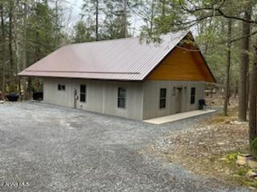 Beautiful one story home on 3 lots in the gated community of Glendale Yearound. Superior wall construction this home is equipped with smart home technology.  Two bedrooms, living room/kitchen combo. Center island and separate laundry/pantry room. 1.75 baths.  Front porch and rear porch could be used as carport also. Greenhouse included. Large shed.  Great getaway home or primary residence with privacy of 3 lots!