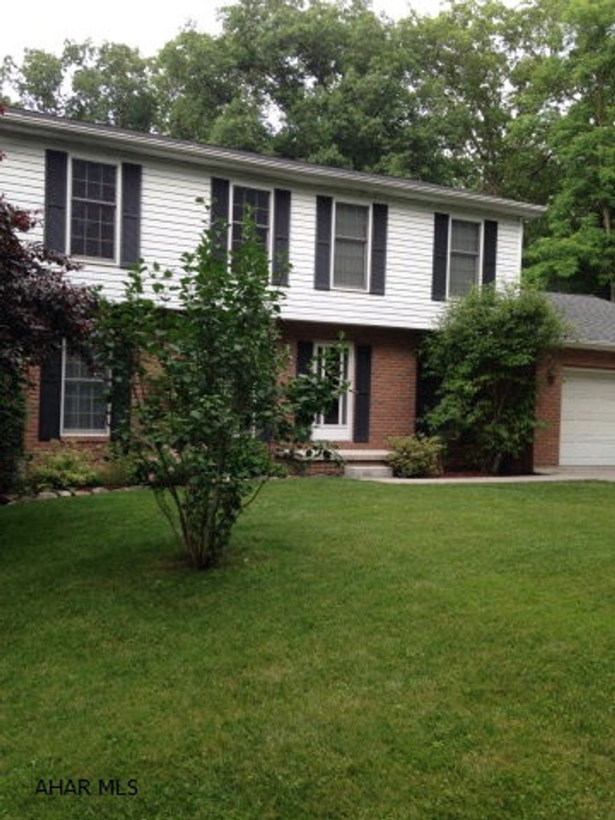 Spacious 2 story with many amenities. Perfect home for entertaining! Enjoy the summer with the above ground pool & hot tub/spa. Relax on the deck off the first floor living room while looking over the beautiful back yard. Family room has a fireplace. Recreation room in basement includes pool table. Listing agent is relative of owner.