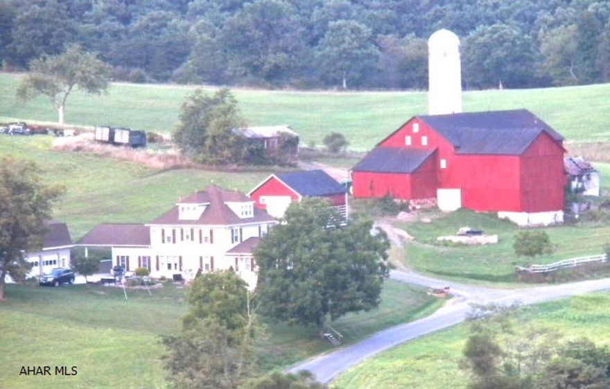 109.87 acre farm with approximately 80 tillable acres nestled in the foothills of the Alleghany Mountains within a 2 hour drive of Pittsburgh, Washington, D.C. And Virginia. Panoramic views surround the gorgeous restored farm home while a lovely stream winds along the property's boundary. Features of the home include a designer inspired master suite with walk in shower, separate soaking tub, granite counters, his and her custom closets and views that will take your breath away. A huge family room with custom built in cabinets ensures plenty of room for large group entertaining. Four car garage with extra storage and workspace, barn and outbuildings add to the overall appeal of this exceptionally priced property.