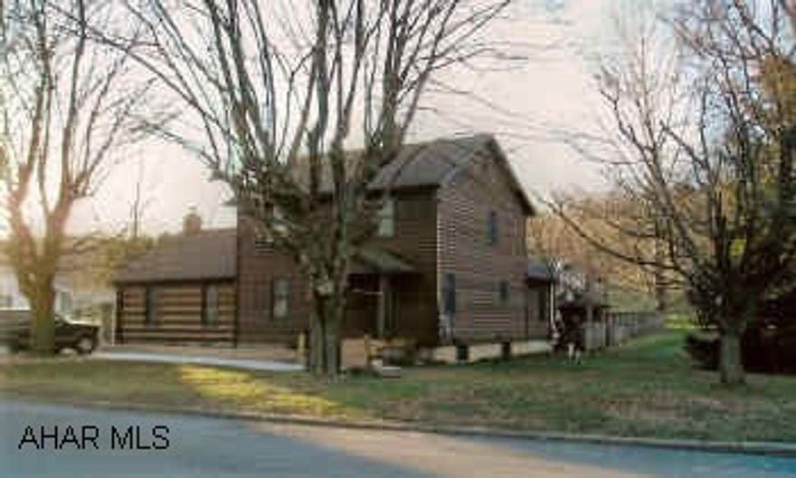 Beautiful country style home w/in-town convenience. Great Room w/hardwood floors, inviting fireplace and opens onto a large deck. New fish pond. Large 28x48 2-story building w/4 rooms, 1/2 bath and heat.