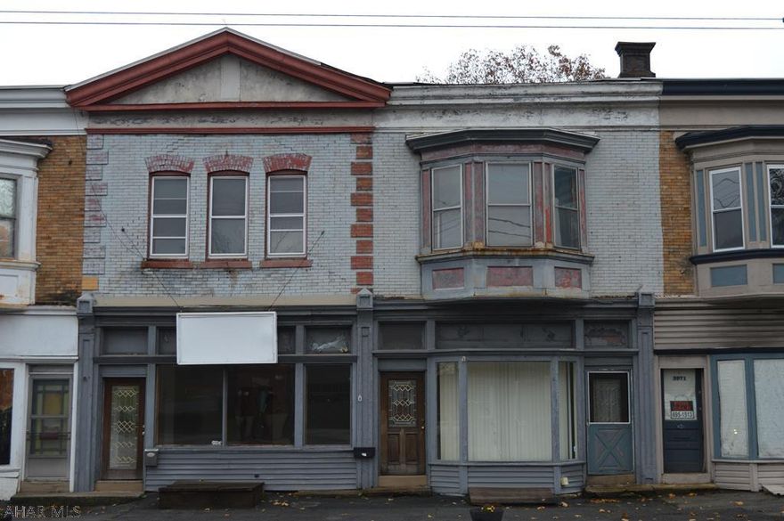 Two Knickerboker units for sale with commercial store front on main level and apartments on second level. Good income potential with mixed commercial and residential rentals with 8 off street parking spots in rear of building. As is sale please use caution when showing Please refer to mls # 53048 for other property.