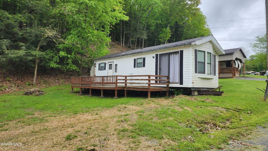 Year-round living or weekend getaway awaits you in the campgrounds of Glendale Yearround. This 1988 Chariot Eagle Park-Model mobile home is fully equipped for cozy comfort. 1 full bed, 1 full bath, eating area in the kitchen (which has plenty of counter and cabinet space). The living room boasts lots of natural sunlight through the front bay windows and the sliding glass doors that lead to the oversized deck. There is a shed that is also included. Everything stays! Glendale Yearround in a private gated community that has a community pool, tennis and basketball courts, trails and more!