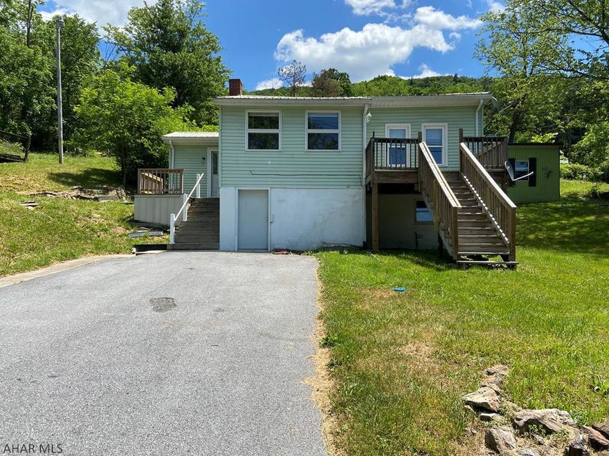 The price is right for this cozy 1 bedroom, 1 bath home in a great location!  Perfect starter home with all kinds of potential or rental.  Enjoy mountain views and beautiful sunsets from the deck.