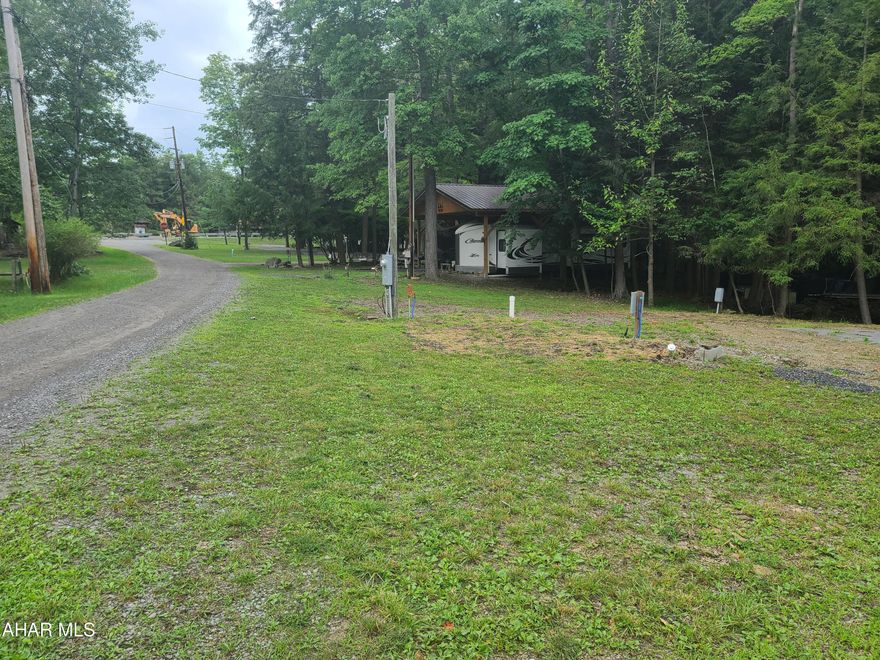 2 vacant campsite lots inside Glendale Yearound for sale. There is a small stream at the back of the sites. A small pond is a minute walk away.  Lots have water, sewer and electric.
Each site has 100 amp service. Glendale Yearound is a gated community located minutes from Prince Gallitzin State Park and Glendale Lake.