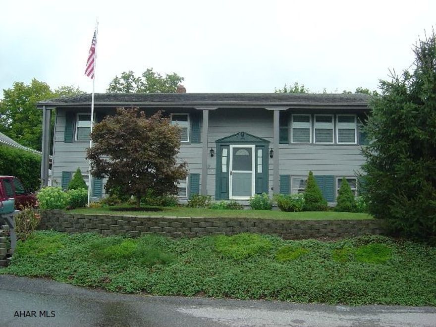 Beautiful Split Foyer home with nicely landscaped front yard. Walk into the front foyer with oak stairs and custom oak rails to a move in condition home. Lenox as furnace and central air. 3 bedroom, 1 2/3 bath, eat-in kitchen, dining room, living room, lots of closet space and a pantry in the kitchen. New thermo double hung windows. A large deck is on the back to just sit and listen to the birds overlooking a beauitful landscaped back yard. Down stairs there is a real nice large family room with a 30,000 btu gas heater and a area for a office or could be a forth bedroom. Another large room that could be used for storage or even made into other rooms. Laundry room and large 1/2 bath. There is also a walk out basement door to the back yard.