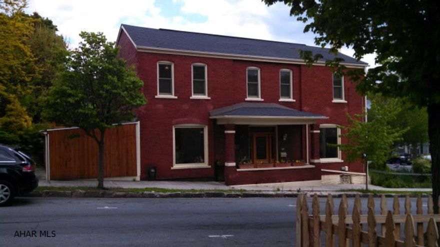 Very unique and charming historic home with great character.  Some of the features include: high ceilings, interior brick and wooden walls, tin-like ceilings, large bedrooms, built-ins, corner lot, fenced yard, 2 ponds, flower gardens, concrete driveway, etc.  Must see to appreciate. Please note that a 1-year home warranty is included.